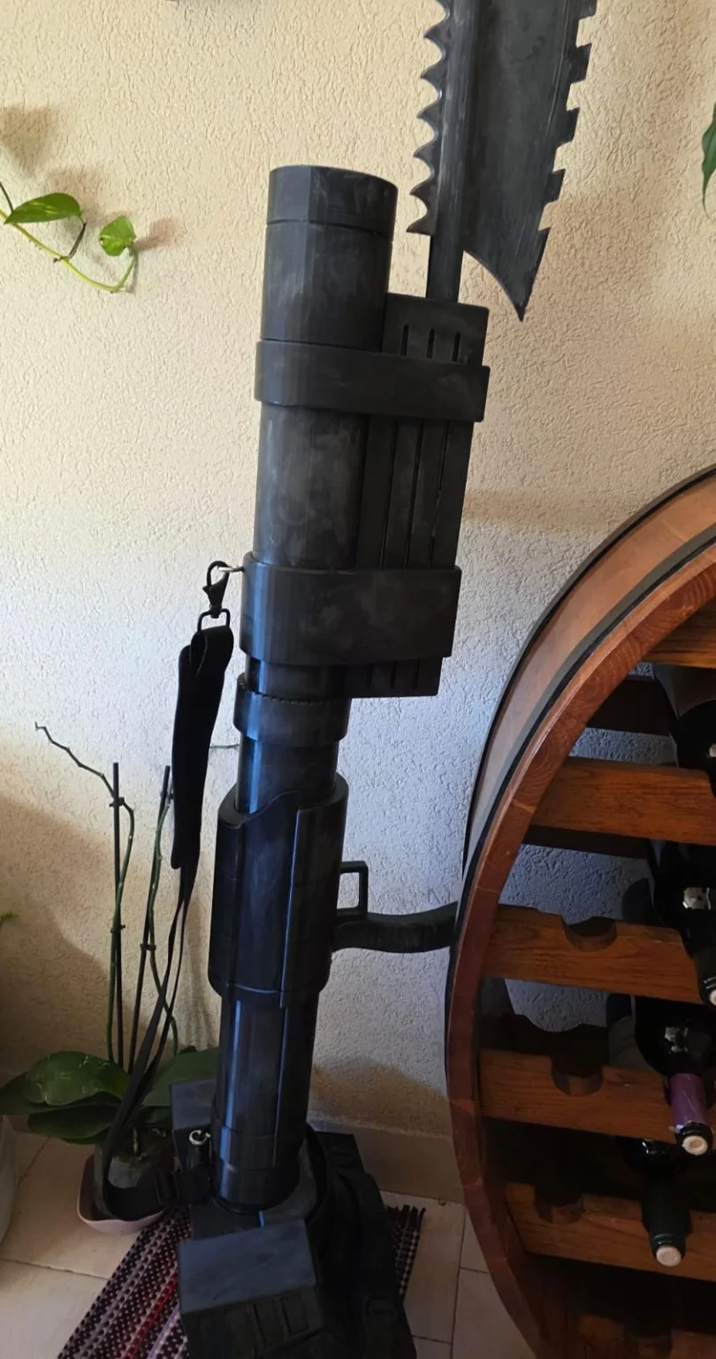 Large launcher prop shown alongside another oversized prop for scale